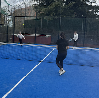 Friends playing padel together